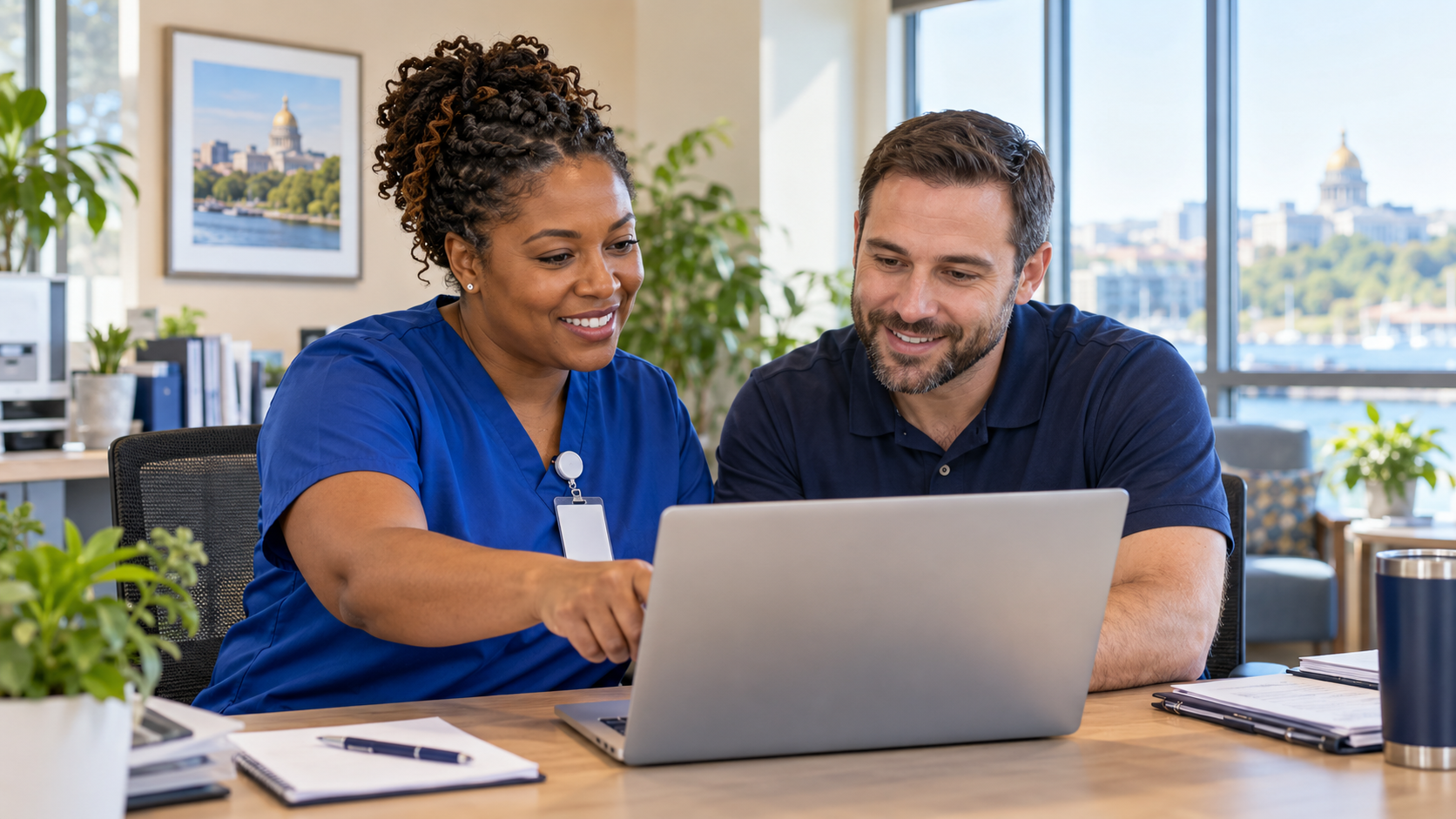 Healthcare IT Services Massachusetts professional working with an IT specialist